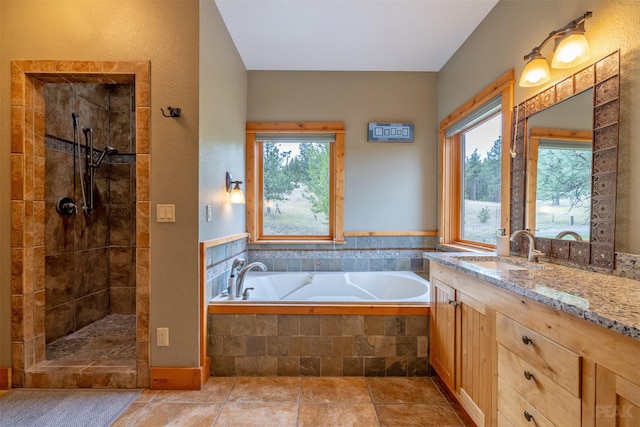 214 Solomon Mountain Rd, Clancy, MT 59634 - full bathroom with a bath, healthy amount of natural light, vanity, and tiled shower