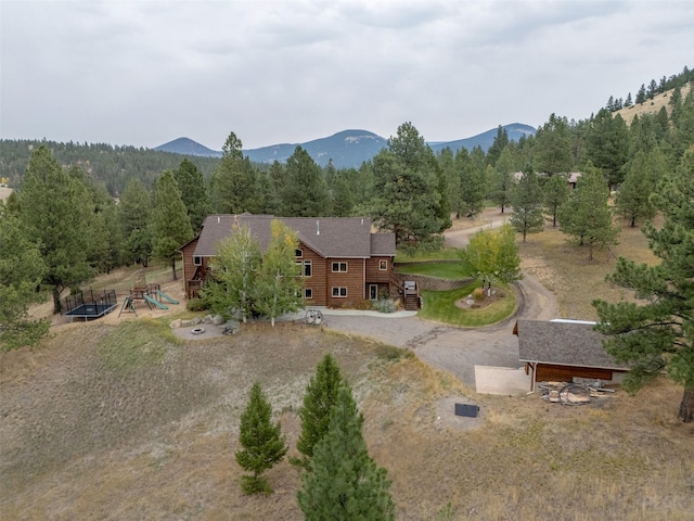 214 Solomon Mountain Rd, Clancy, MT 59634 - aerial overview of property's location featuring a mountain backdrop and a forest