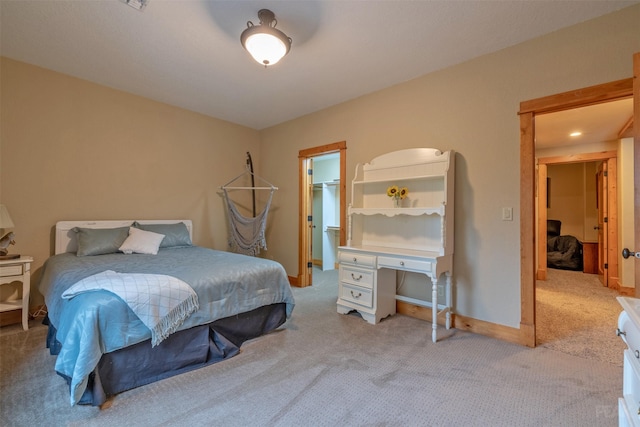 214 Solomon Mountain Rd, Clancy, MT 59634 - carpeted bedroom featuring a walk in closet and baseboards