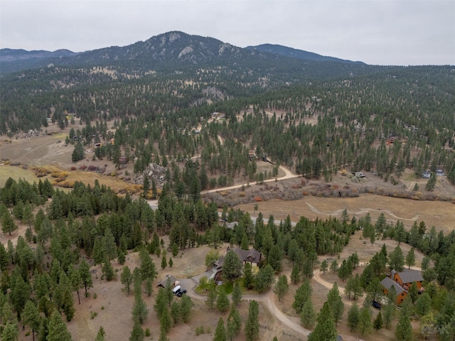 214 Solomon Mountain Rd, Clancy, MT 59634 - aerial view of property and surrounding area with a mountainous background and a heavily wooded area