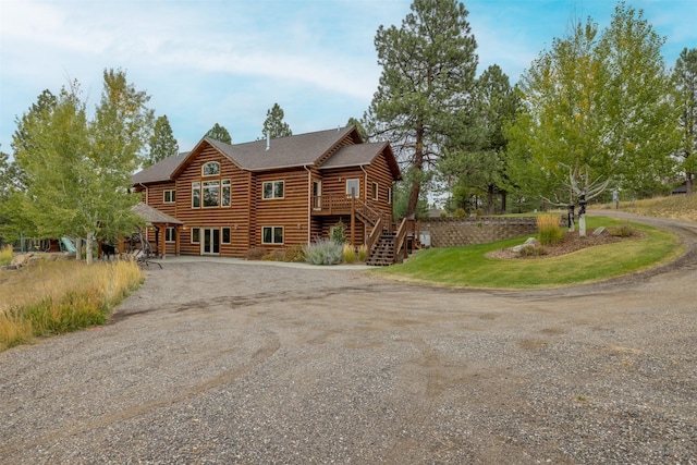 214 Solomon Mountain Rd, Clancy, MT 59634 - view of front of property featuring dirt driveway, stairs, a wooden deck, and log siding