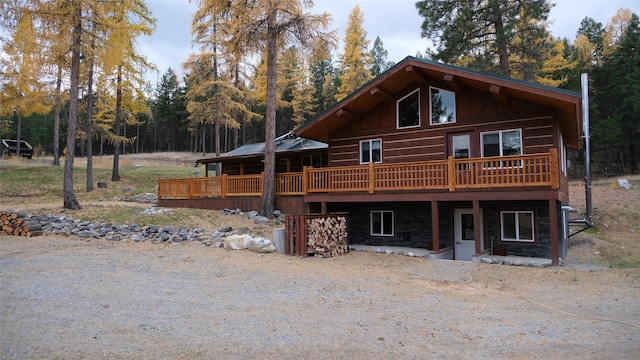 log home featuring a wooden deck