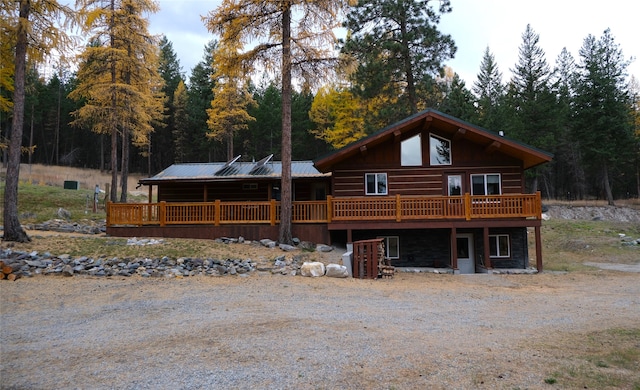 log home featuring a wooden deck