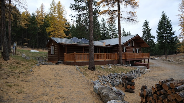 exterior space featuring a wooden deck