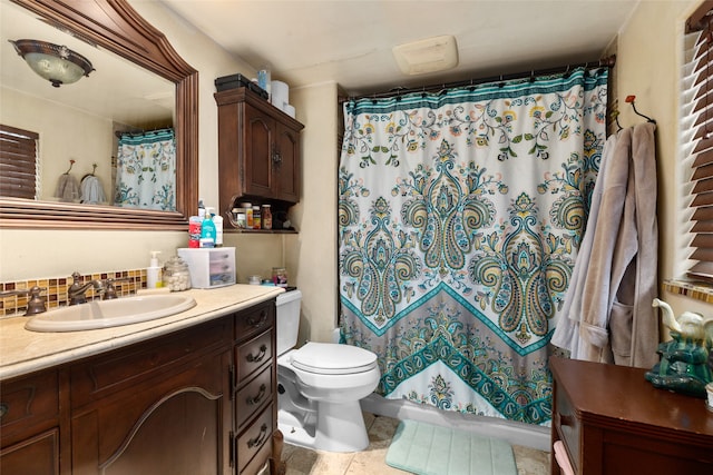 bathroom with toilet, tile patterned flooring, a shower with curtain, backsplash, and vanity