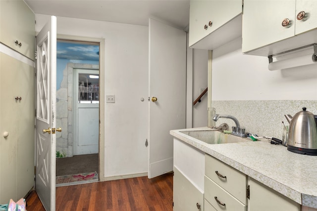 kitchen featuring sink and dark hardwood / wood-style flooring