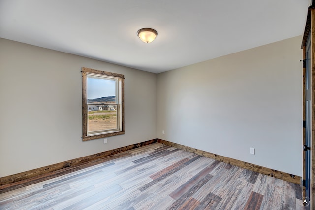 unfurnished room featuring light hardwood / wood-style floors