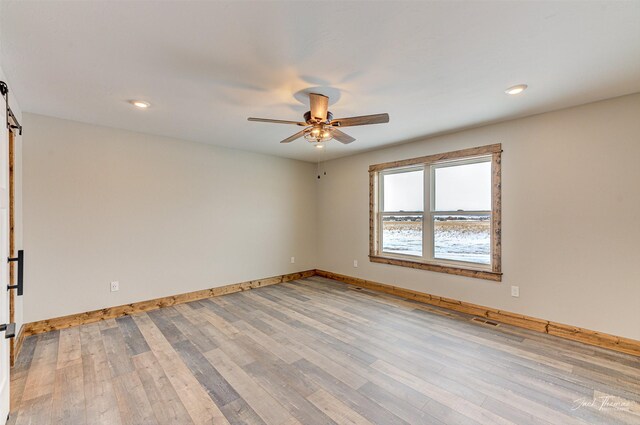 bathroom featuring hardwood / wood-style floors, toilet, and vanity