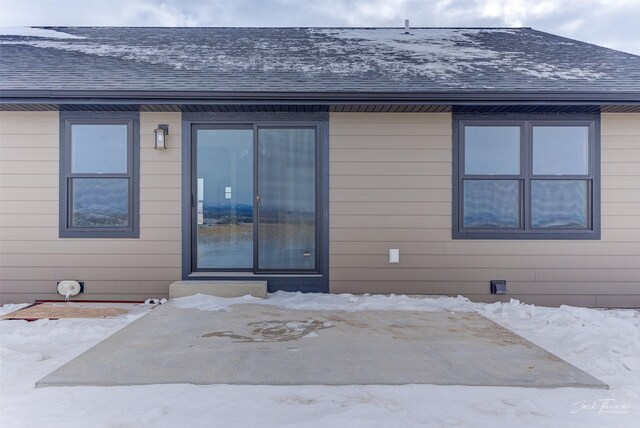 view of snow covered house