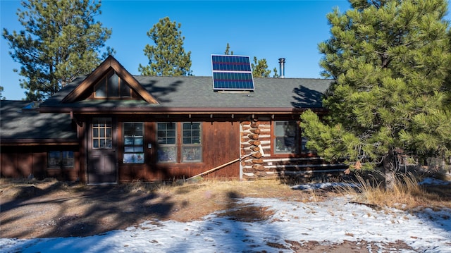 view of front of home featuring solar panels