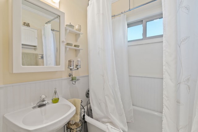 bathroom featuring sink and shower / bath combo with shower curtain