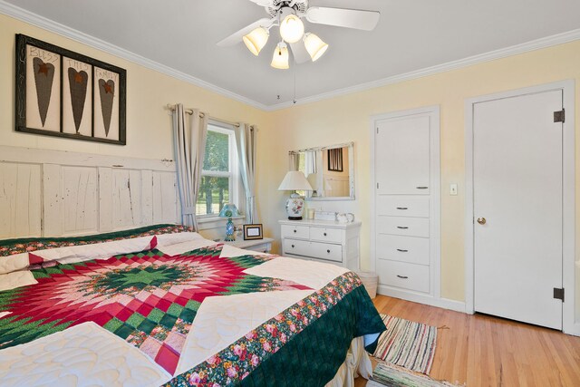 bedroom featuring ceiling fan, ornamental molding, and light hardwood / wood-style floors