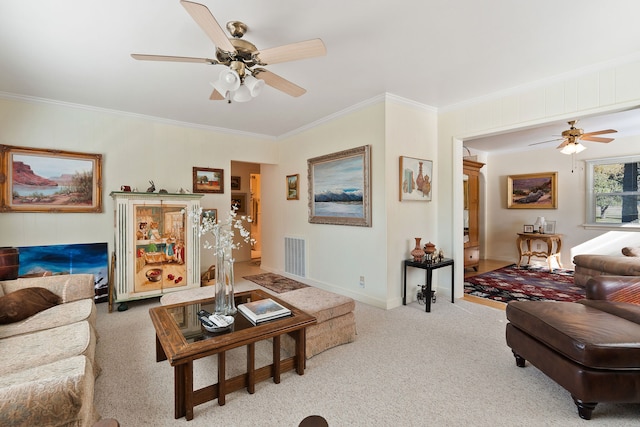 carpeted living room with ornamental molding and ceiling fan