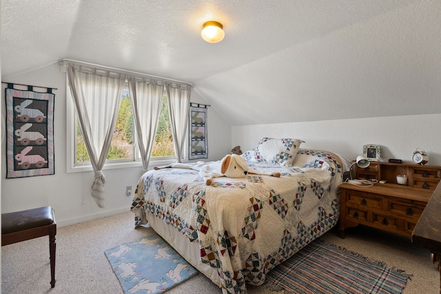 carpeted bedroom with a textured ceiling and vaulted ceiling