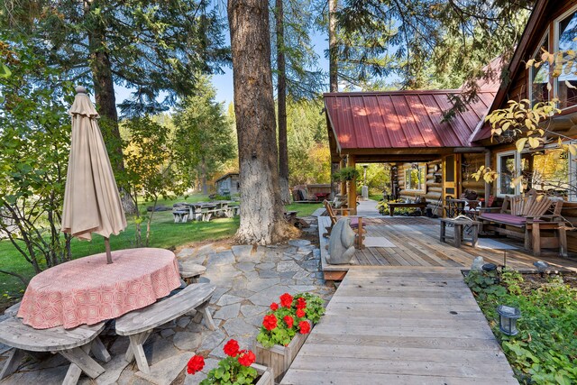 view of patio / terrace with an outdoor living space and a wooden deck