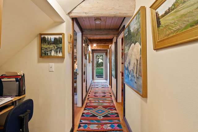 hall featuring hardwood / wood-style floors and wooden ceiling