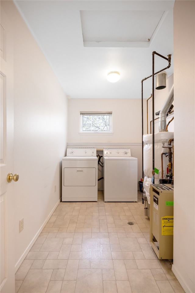 clothes washing area with washer and clothes dryer