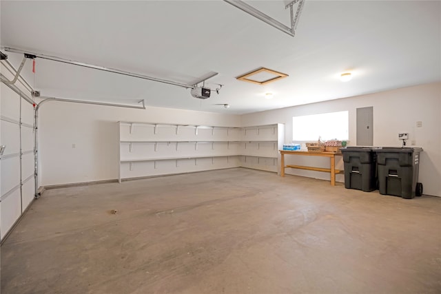 garage featuring a garage door opener and electric panel