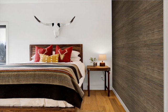 bedroom with wood-type flooring