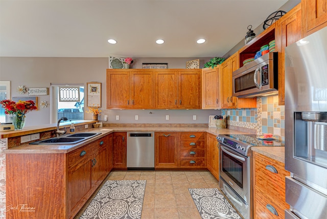 kitchen featuring light tile patterned floors, stainless steel appliances, sink, and backsplash