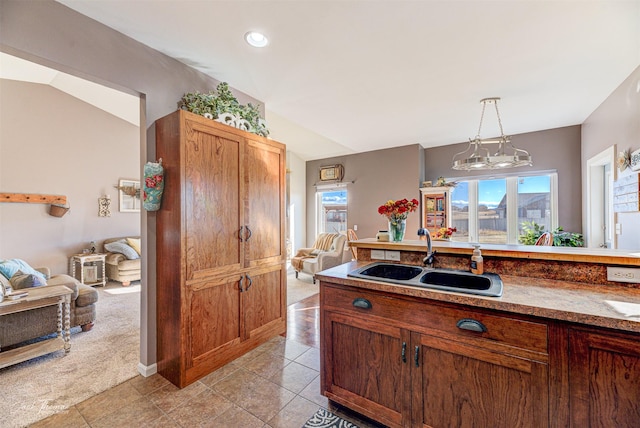 4349 Stoney Rd, Helena, MT 59602 - kitchen with a sink, healthy amount of natural light, decorative light fixtures, and light colored carpet