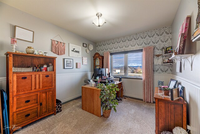 carpeted home office with wood walls