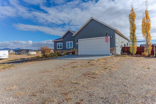 4349 Stoney Rd, Helena, MT 59602 - ranch-style house with dirt driveway and a garage
