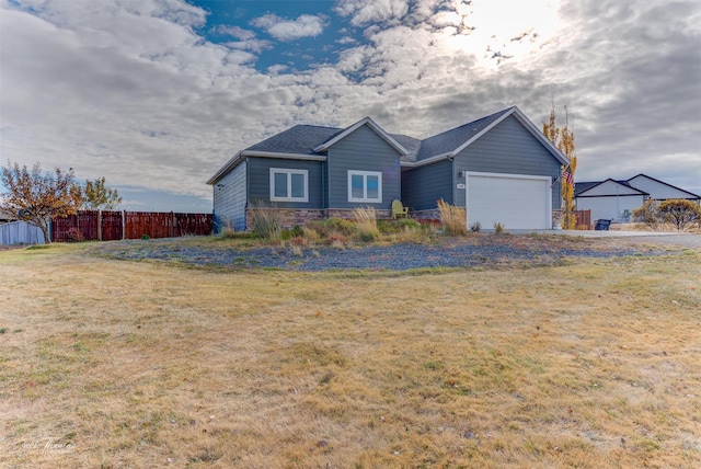 4349 Stoney Rd, Helena, MT 59602 - ranch-style house featuring an attached garage, stone siding, and driveway