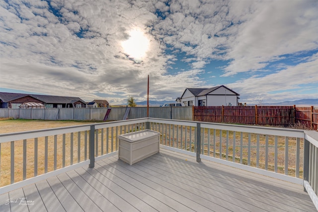 wooden deck with a lawn