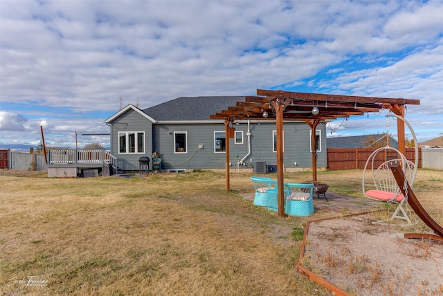 4349 Stoney Rd, Helena, MT 59602 - rear view of house with a pergola, central AC, a wooden deck, and roof with shingles
