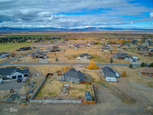 birds eye view of property featuring a mountain view