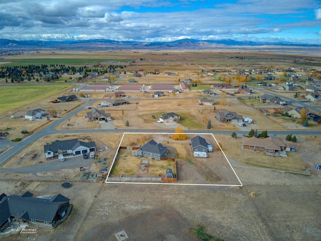 birds eye view of property featuring a mountain view