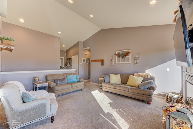 carpeted living room with vaulted ceiling