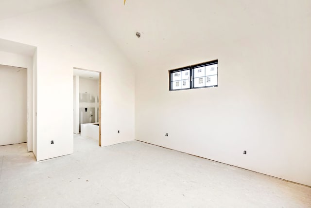 unfurnished bedroom featuring high vaulted ceiling