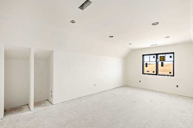 empty room with lofted ceiling