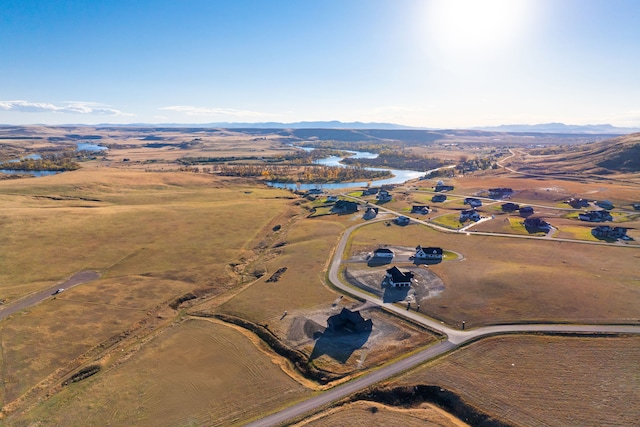 birds eye view of property featuring a mountain view