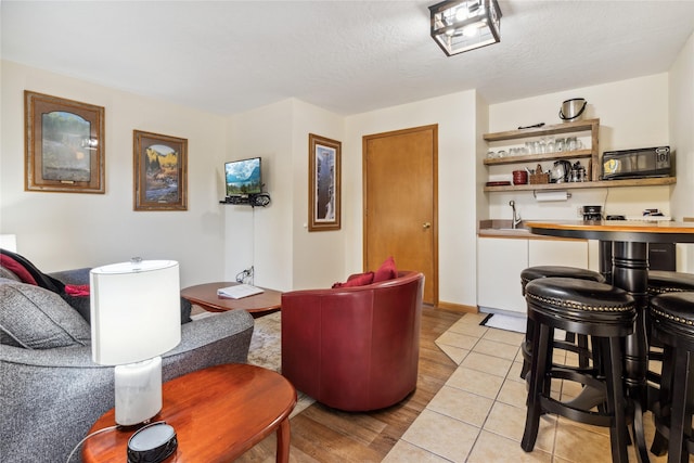 180 Vista Ln Unit 137, Bigfork, MT 59911 - living room with bar with sink and light wood finished floors