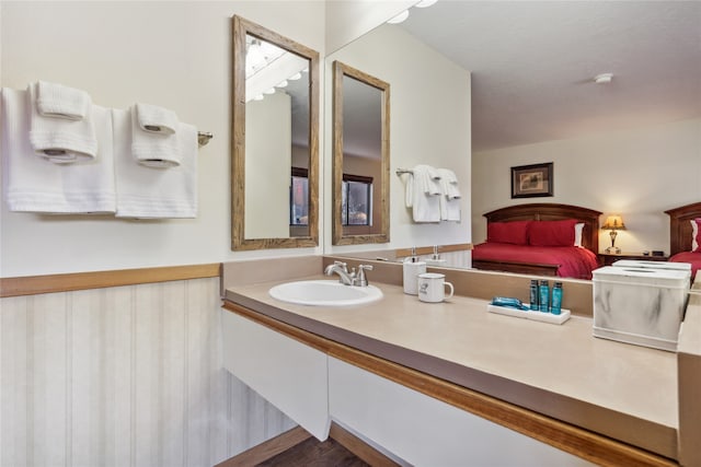 bathroom with vanity and hardwood / wood-style floors