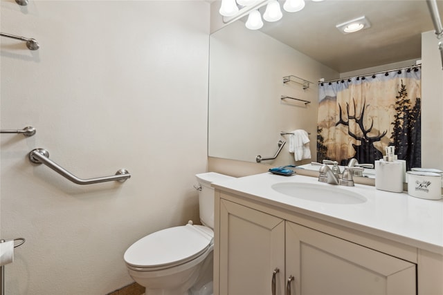 bathroom with vanity, a shower with curtain, and toilet