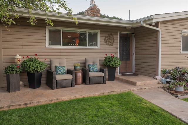 doorway to property with a yard