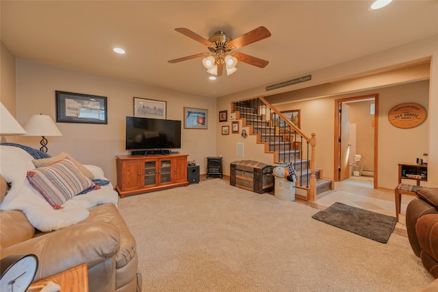 carpeted living room featuring ceiling fan