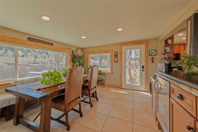 dining space featuring light tile patterned flooring