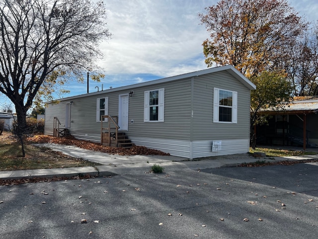 manufactured / mobile home with a carport