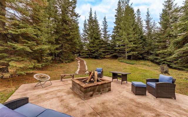 view of patio / terrace featuring an outdoor fire pit