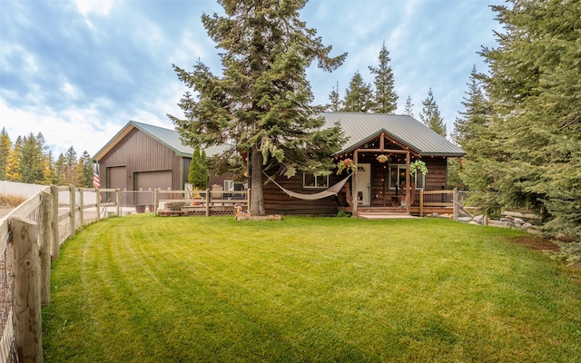 view of yard featuring an outdoor structure and a garage