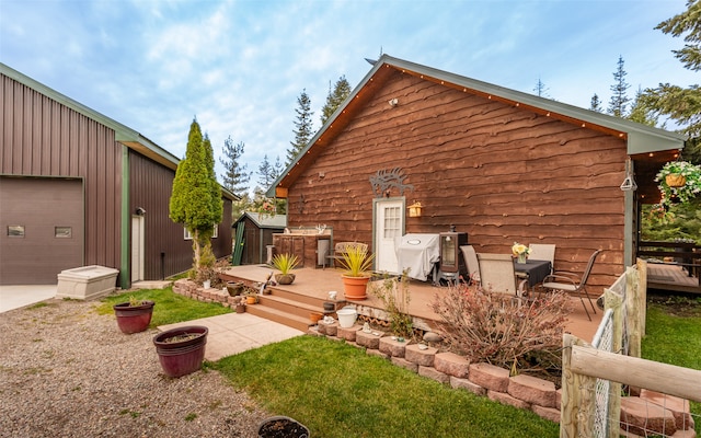 rear view of house featuring a deck