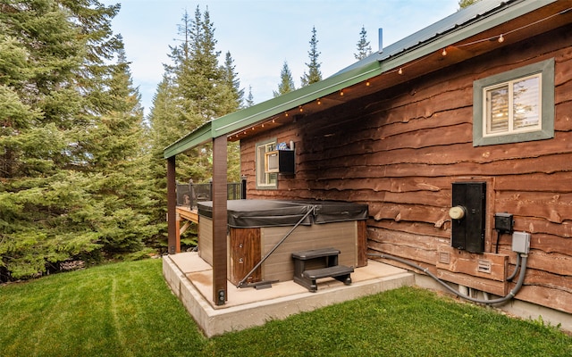 exterior space featuring a hot tub