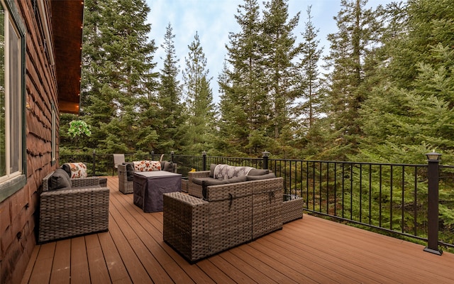 wooden deck featuring outdoor lounge area