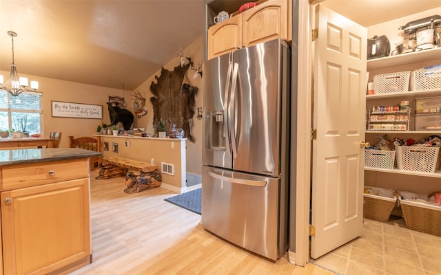 kitchen featuring hanging light fixtures, a chandelier, light brown cabinetry, light hardwood / wood-style flooring, and stainless steel refrigerator with ice dispenser