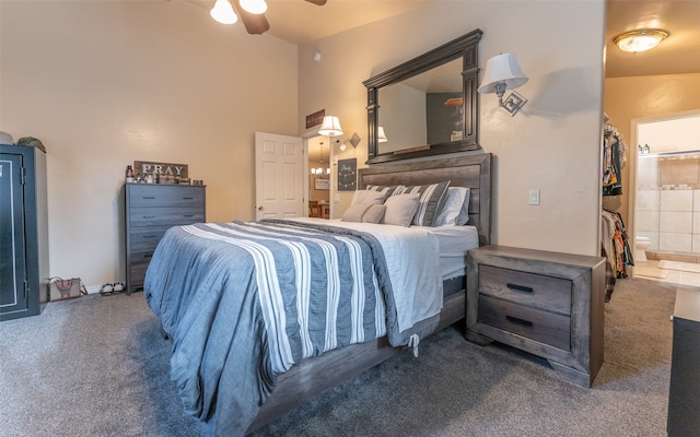 carpeted bedroom featuring connected bathroom, a towering ceiling, and ceiling fan